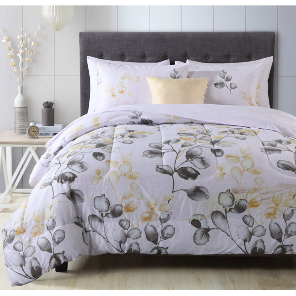 pale yellow and white and light blue comforter